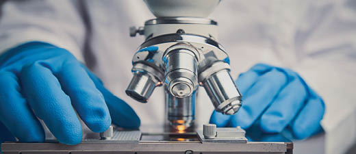 Close-up shot of microscope with metal lens.